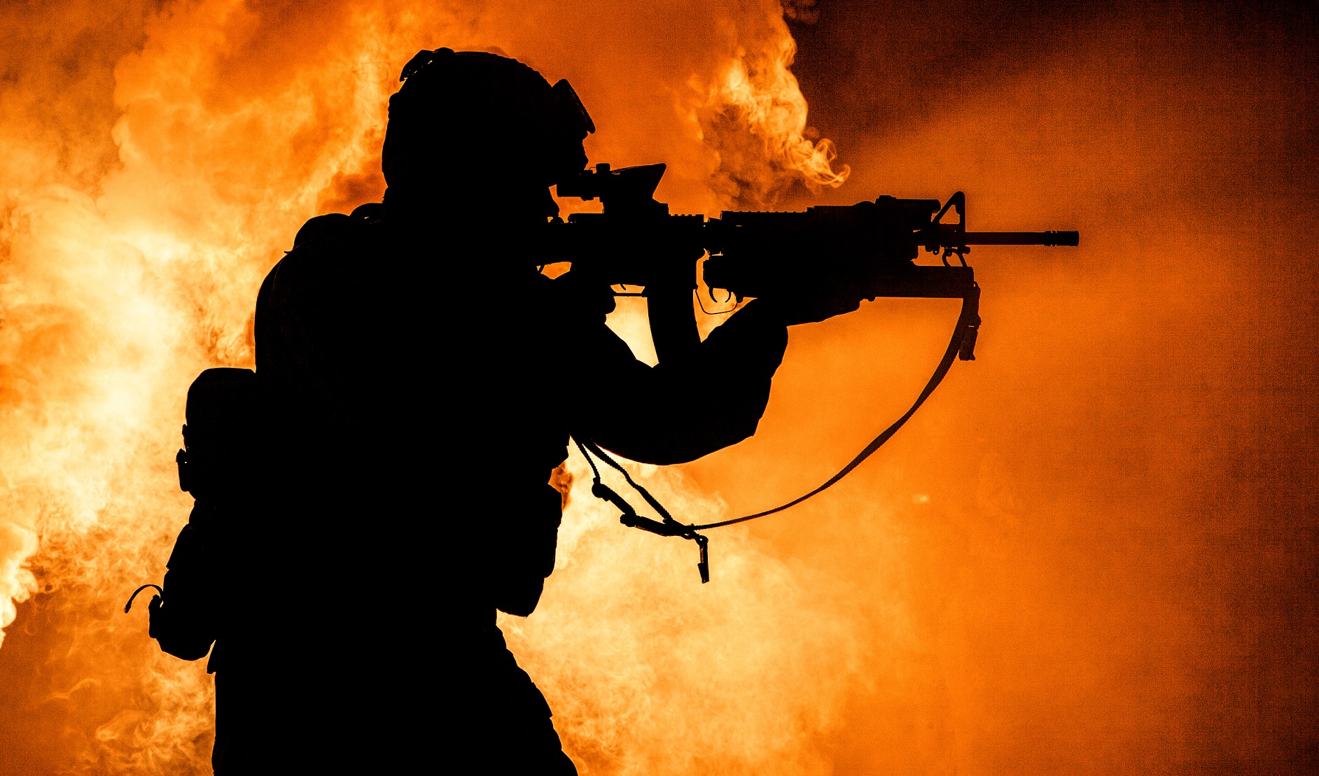 soldiers silhouette on background of fire explosio M5P3NKE Беларусь Беларусь