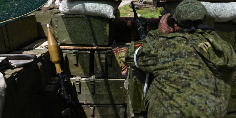 a russia backed rebel observing ukrainian army positions though firing port at his position near donetsk eastern ukraine may 17 2015 новости Россия, Схид, украина