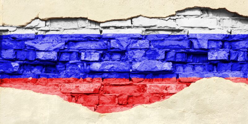 russian flag on brick wall 2021 09 04 11 31 45 utc новости IDFI, Грузия-Россия, Компания