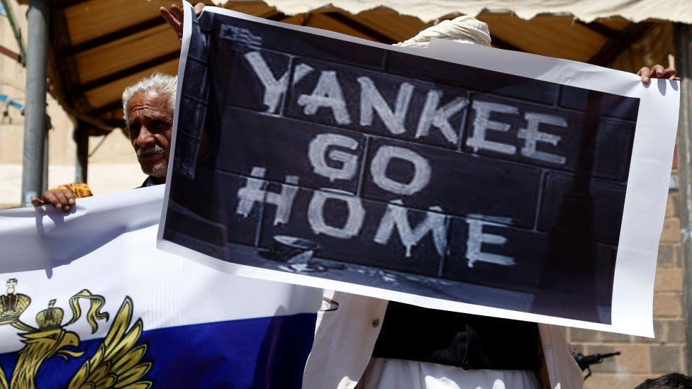 Yemenis participate in a protest staged for supporting Russian President Vladimir Vladimirovich Putin in his war on Ukraine, outside the Russian embassy on March 24, 2022 in Sana'a, Yemen.