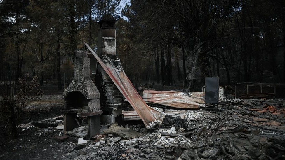 The remains of a burnt house.