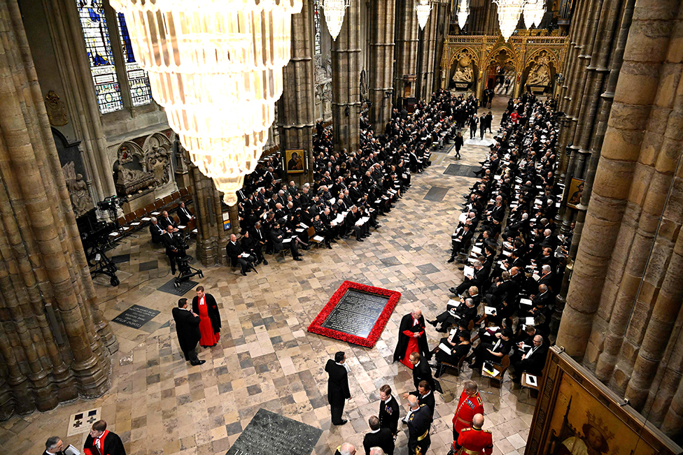 Guests and officials take their seats inside Westminster Abbey in London on 19 September 2022, for the State Funeral Service for Britain's Queen Elizabeth II