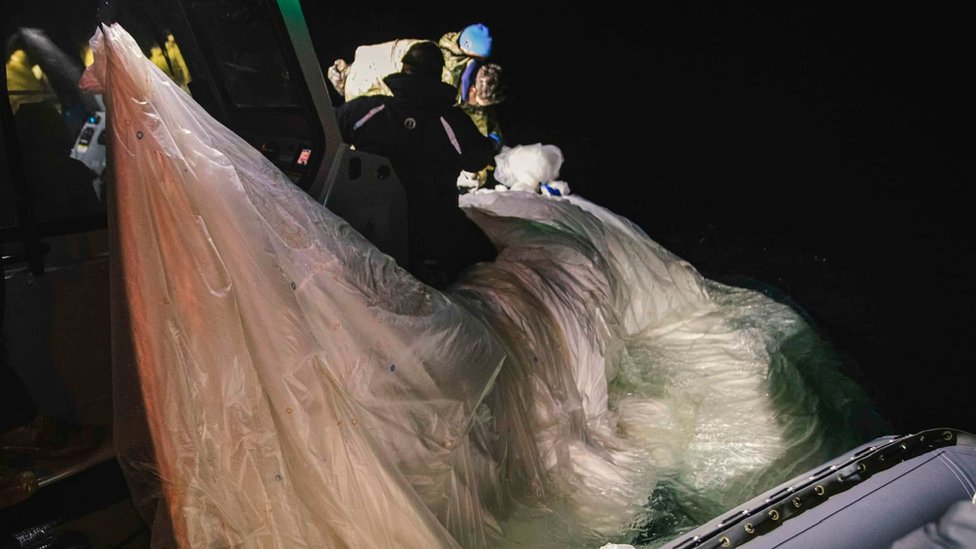 Balloon being hauled into boat