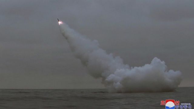 A missile heads towards the sky after being fired from under water