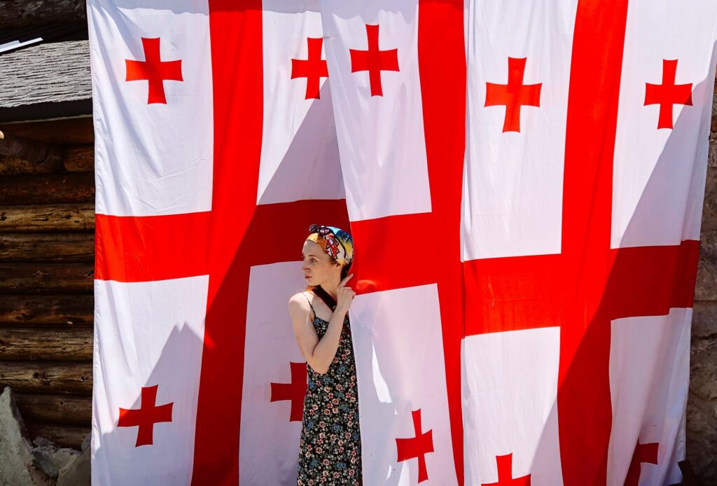 summer a girl near three huge georgian flags 2022 11 15 23 30 03 utc общество featured