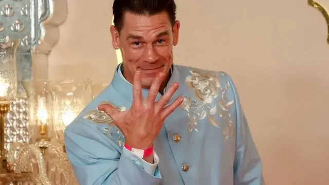 WWE legend John Cena joked with reporters as he walked the red carpet