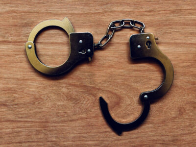 handcuffs on wooden background 2024 12 06 12 34 34 utc политика 4 октября, featured, Георгий Чахунашвили, Грузинская мечта