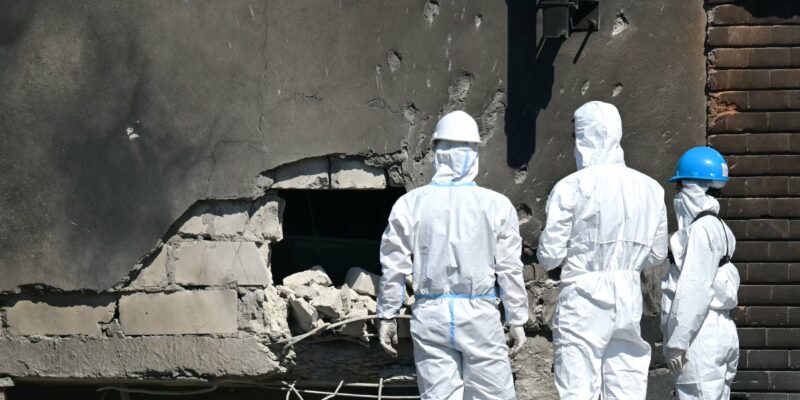 Forensic investigators examine the location of impact after a Russian drone struck an apartment building in Galati, eastern Romania