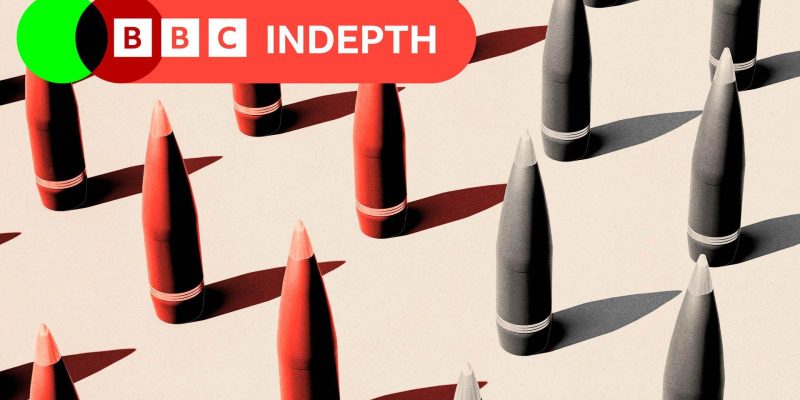 A treated image showing missiles coloured red and grey. They sit against a beige background.