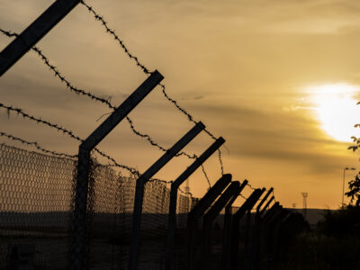 Inmate Claims He Sewed His Mouth Shut Over Pressure at Geguti Prison 2 barbed wire fence against a fiery orange sky 2026 09 23 19 52 49 utc News