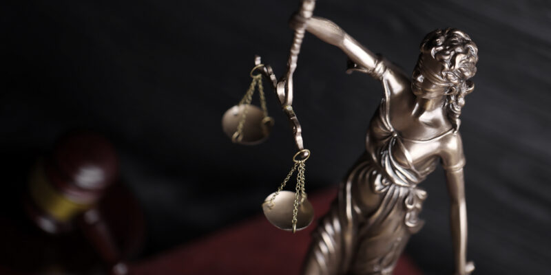 scales of justice with gavel on dark background 2026 09 24 07 04 56 utc Society featured